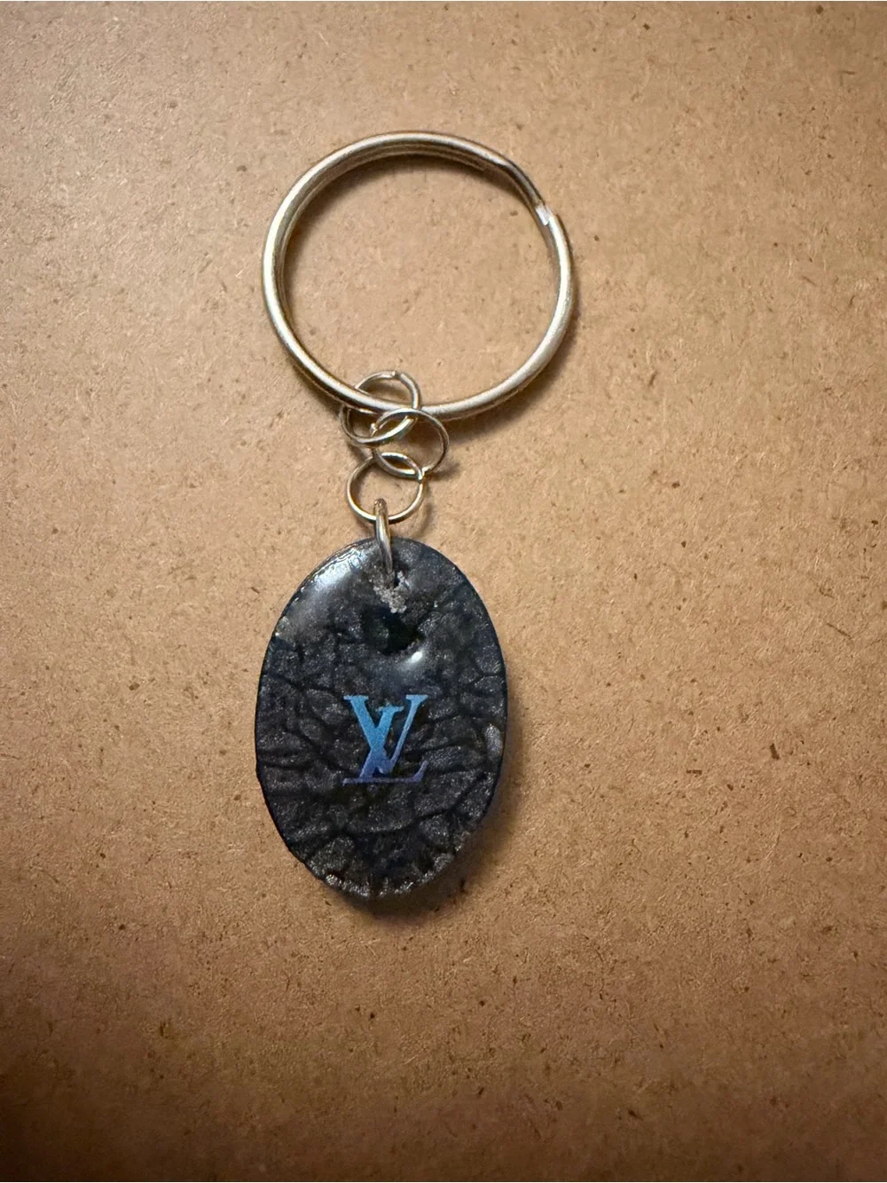 Fashion inspired  Black Oval Key Fob with Blue letters